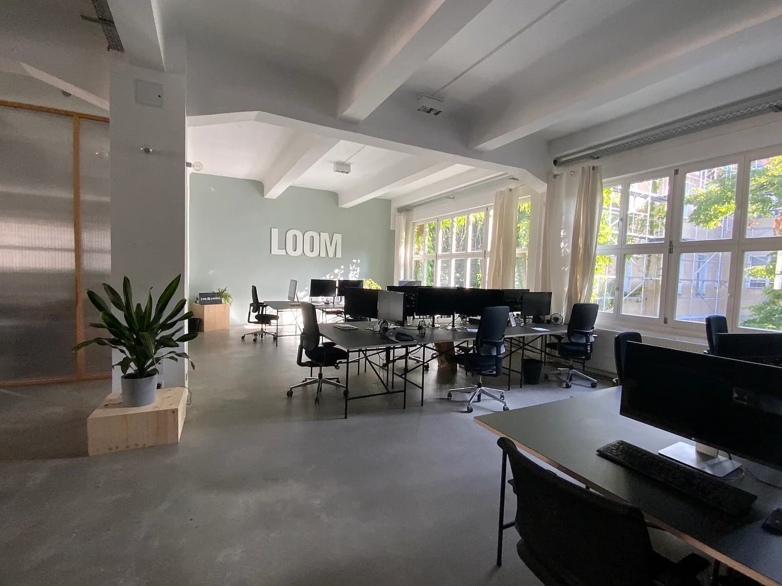 Multiple computer workstations in a bright office